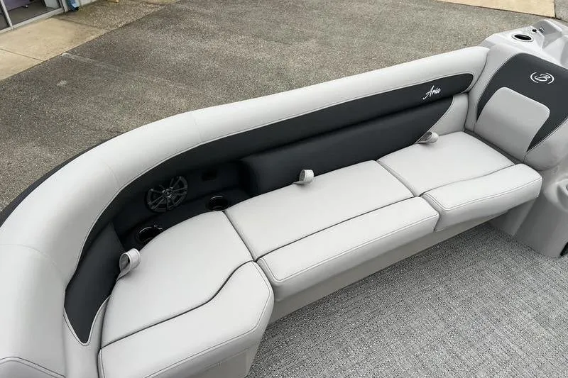 Slide: The Image of 2025 Barletta Aria 24UC boat interior with sleek, modern seating and integrated cup holders. - 7
