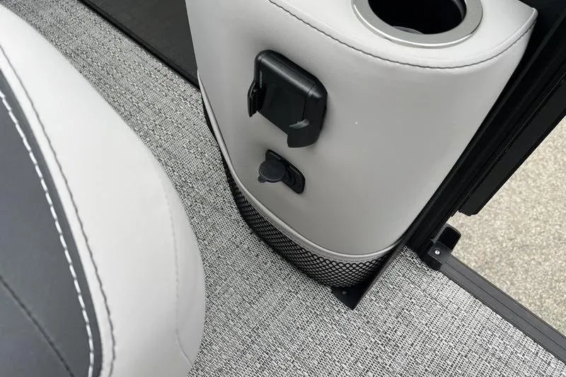 Slide: The Image of 2025 Barletta Aria 24UC interior detail with cup holder and power outlet. - 9