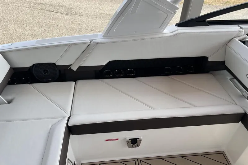 Slide: The Image of Luxurious interior seating of 2025 Cobalt R8 boat with white upholstery and cup holders. - 4