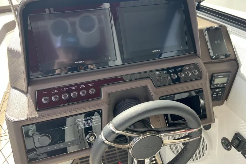 Slide: The Image of 2025 Cobalt R8 dashboard with dual Garmin displays and modern controls. - 6