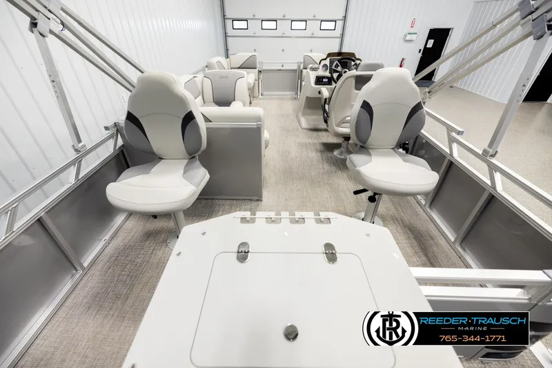 Slide: The Image of 2026 Avalon VEN RF boat interior with modern seating and steering console in showroom. - 16