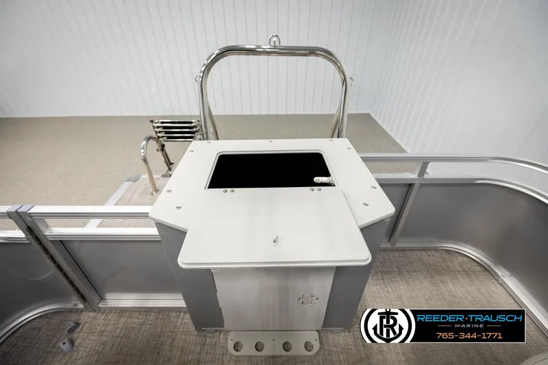 Slide: The Image of 2026 Avalon VEN RF boat interior with stainless steel railing and storage compartment. - 23