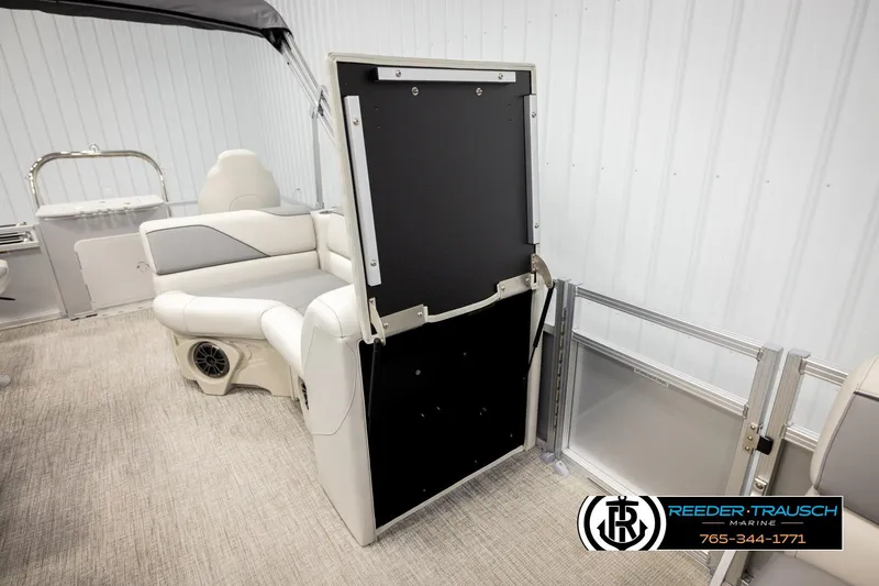 Slide: The Image of 2026 Avalon VEN RF boat interior with seating and storage, Reeder-Trausch Marine branding. - 27