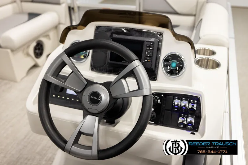 Slide: The Image of Steering console of 2026 Avalon VEN RF boat with modern controls and cup holders. - 28