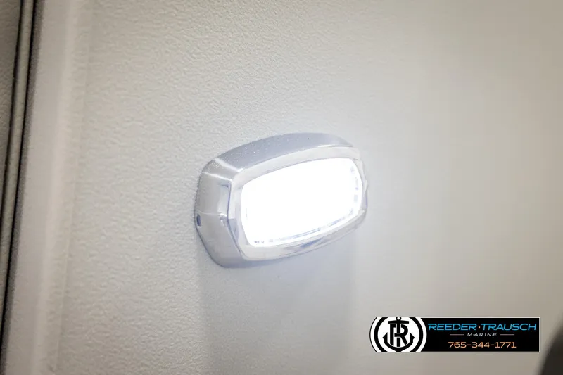 Slide: The Image of LED light on 2026 Avalon VEN RF boat interior, Reeder-Trausch Marine branding visible. - 42