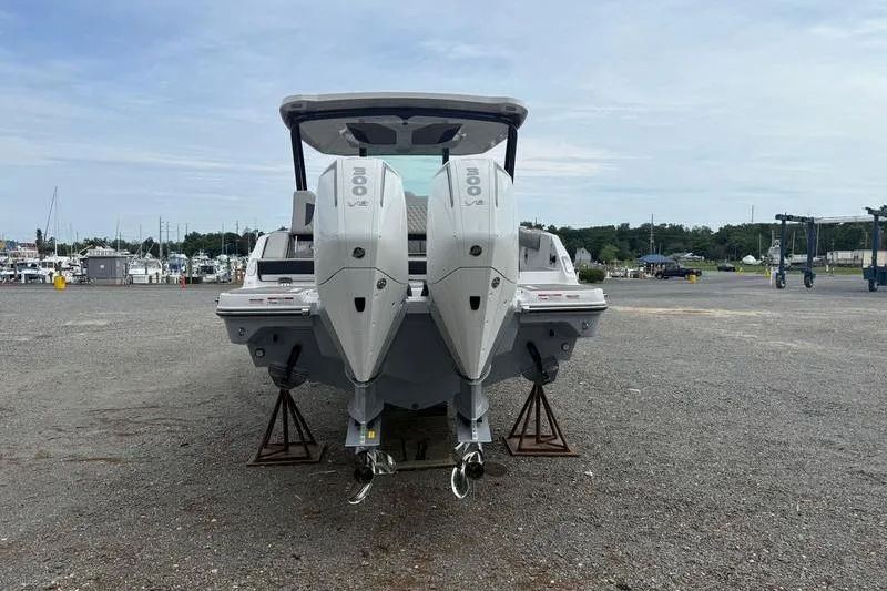 Slide: The Image of 2026 Monterey Elite 30 OB boat with dual outboard engines on display. - 6