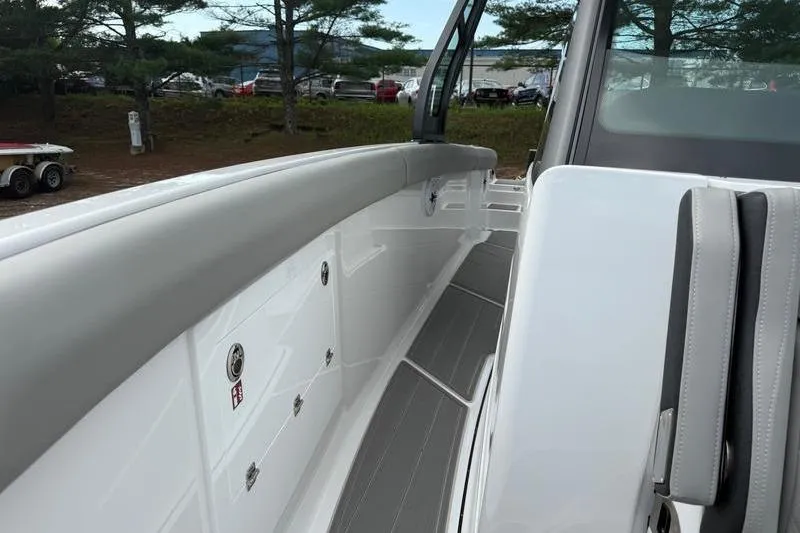 Slide: The Image of 2026 Monterey Elite 30 OB boat interior with sleek seating and modern design. - 8