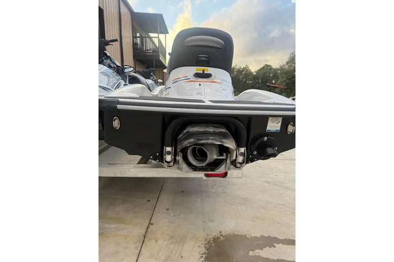 Slide: The Image of Rear view of a 2013 Kawasaki STX150 jet ski on a concrete surface. - 4