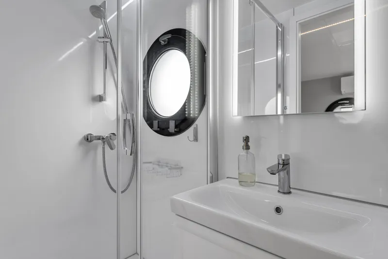 Slide: The Image of Modern bathroom in 2026 Waterlodge Apart L Long, featuring sleek fixtures and round window. - 20