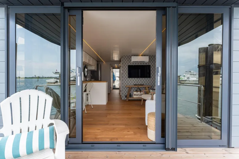 Slide: The Image of Modern Waterlodge Apart L Long houseboat interior with waterfront view, 2026 model. - 22