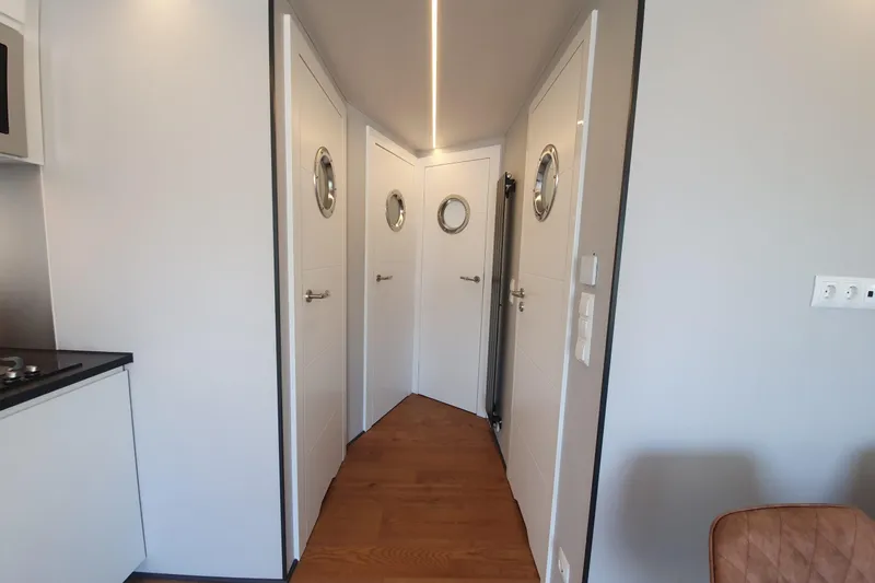 Slide: The Image of Interior of 2026 Waterlodge Apart L Long, featuring modern design and wooden flooring. - 27