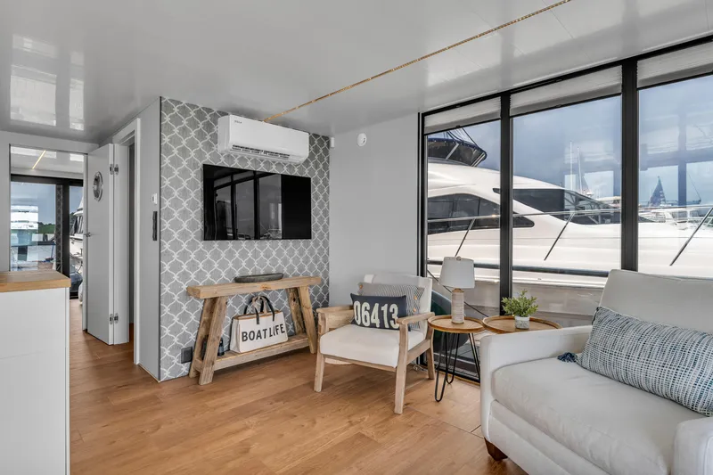 Slide: The Image of Modern interior of 2026 Waterlodge Apart L Long houseboat with stylish decor and large windows. - 6