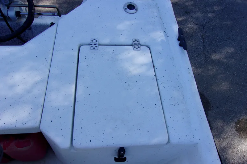 Slide: The Image of 2021 Clearwater Sport Fishing Cape Craft 166CC boat deck with storage compartment. - 11