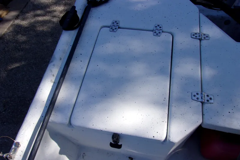 Slide: The Image of 2021 Clearwater Sport Fishing Cape Craft 166CC boat deck with storage compartment. - 12