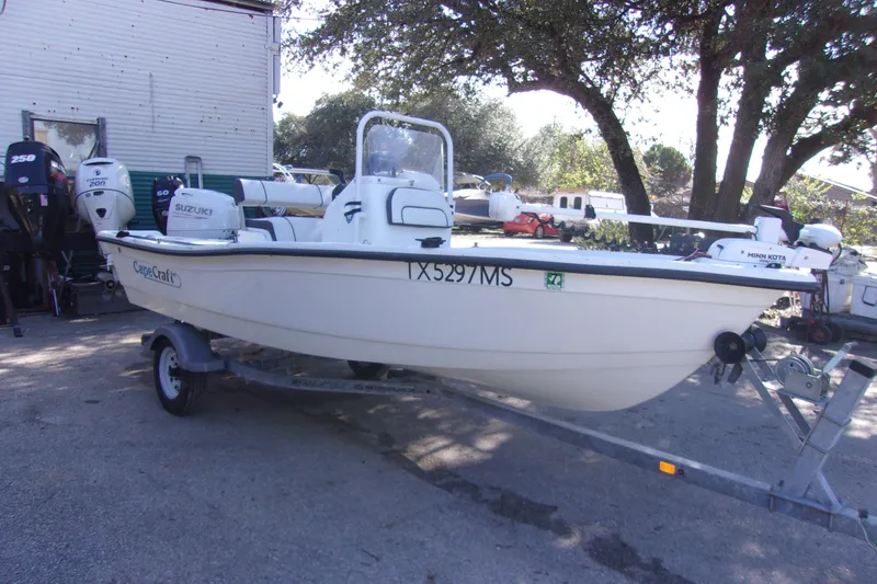 Slide: The Image of 2021 Clearwater Sport Fishing Cape Craft 166CC boat on trailer, parked outdoors. - 2