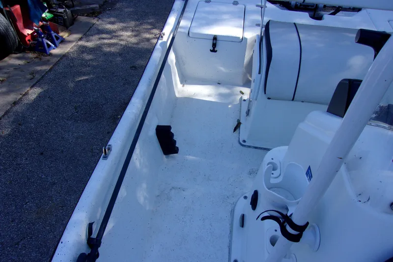 Slide: The Image of 2021 Clearwater Sport Fishing Cape Craft 166CC boat interior, featuring seating and storage compartments. - 8