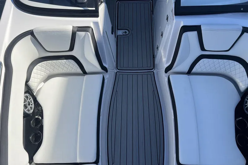 Slide: The Image of 2025 Yamaha Boats 252SE interior with white seating and sleek design. - 19
