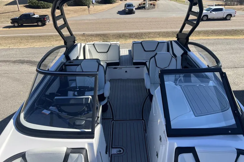 Slide: The Image of 2025 Yamaha Boats 252SE interior, featuring sleek seating and modern design elements. - 21