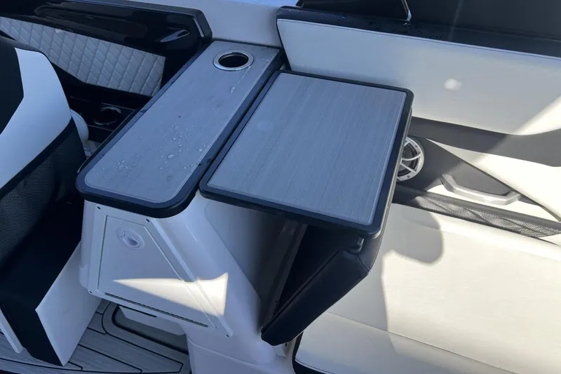 Slide: The Image of 2025 Yamaha Boats 252SE interior with sleek seating and modern table design. - 9