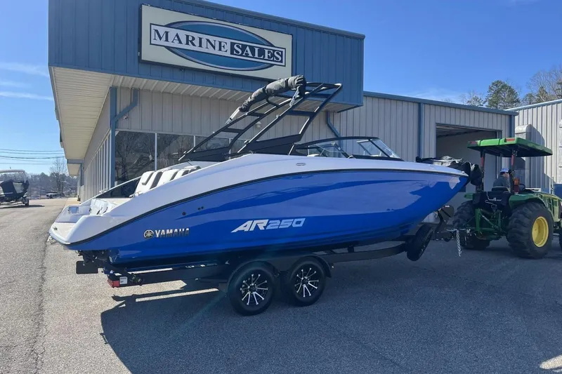 The Image of 2025 Yamaha AR250 boat on trailer outside Marine Sales building. - 0