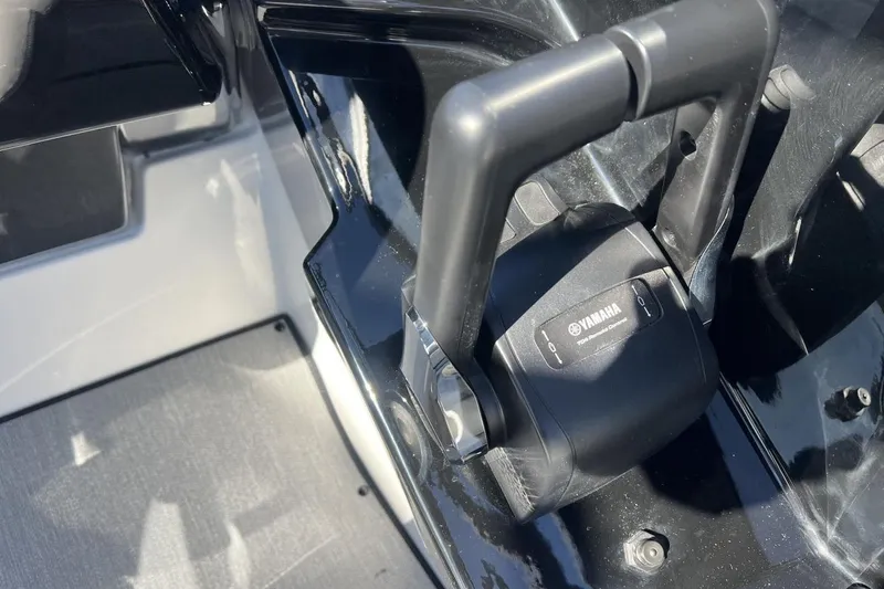 Slide: The Image of Close-up of 2025 Yamaha AR250 boat throttle control handle. - 18
