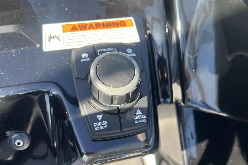 Slide: The Image of Control panel of 2025 Yamaha Boats AR250 with cruise and volume buttons. - 20