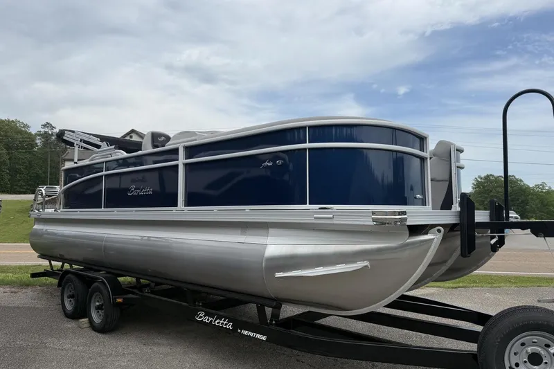 Slide: The Image of 2025 Barletta ARIA 22QC pontoon boat on trailer, side view. - 11