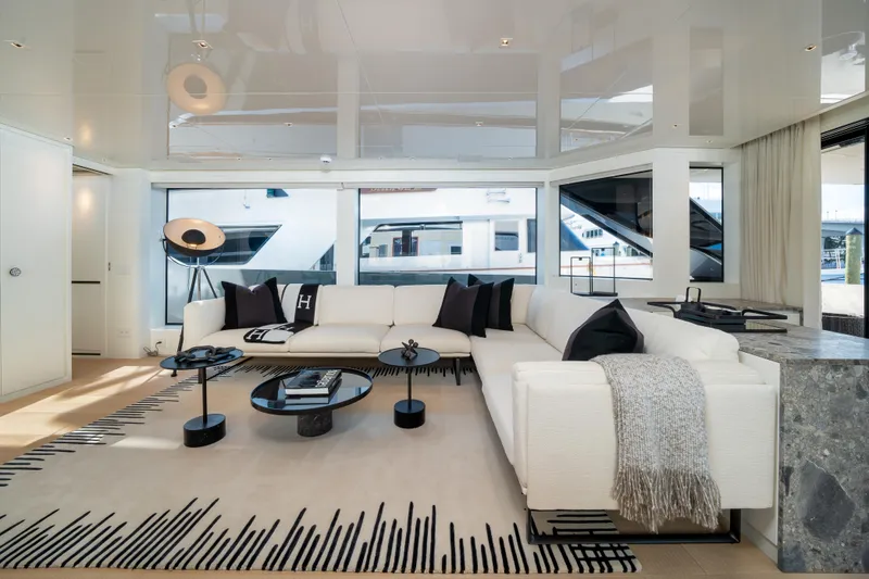Slide: The Image of Luxurious interior of 2022 Sanlorenzo SL96A yacht with modern white sofa and elegant decor. - 11