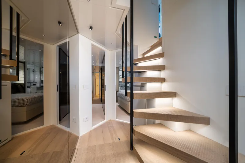 Slide: The Image of Modern interior of 2022 Sanlorenzo SL96A yacht with sleek staircase and elegant design. - 15