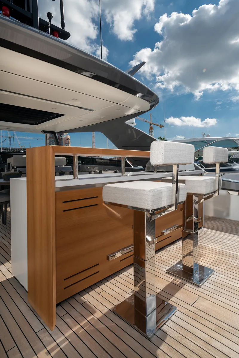 Slide: The Image of Luxury Sanlorenzo SL96A yacht deck with modern bar stools, 2022 model. - 7