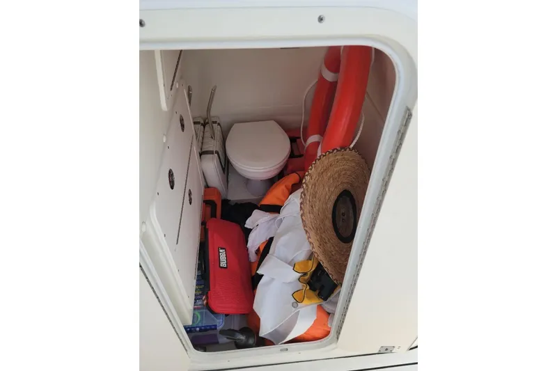 Slide: The Image of Luxury seating on 2021 World Cat 325 CC boat with quilted upholstery and teak flooring. - 10