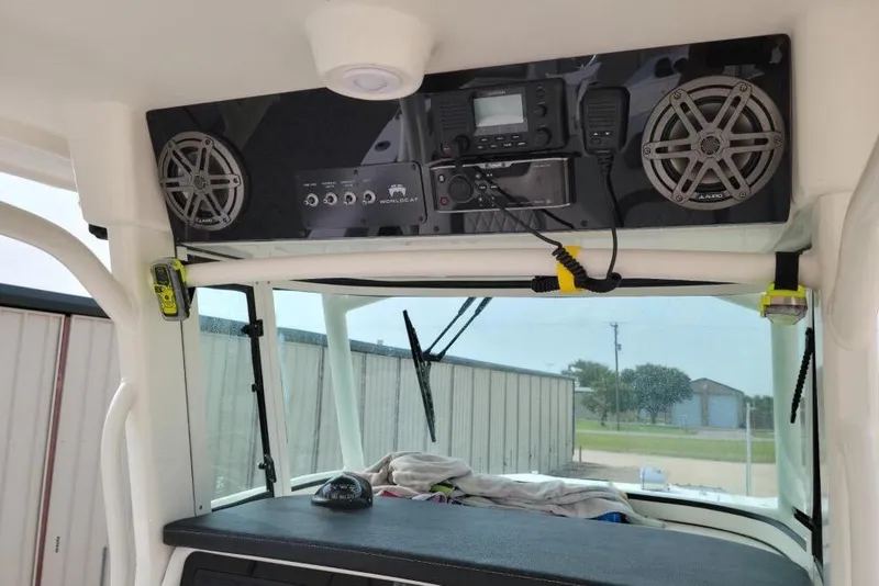 Slide: The Image of 2021 World Cat 325 CC boat interior with spacious seating and modern design. - 12