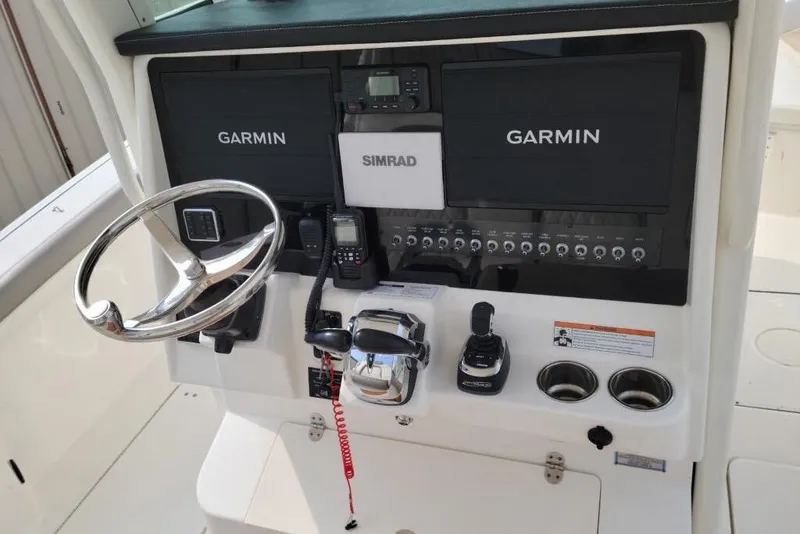 Slide: The Image of 2021 World Cat 325 CC boat interior with audio system and speakers. - 13