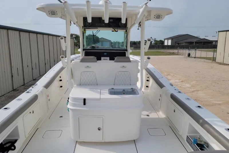 Slide: The Image of 2021 World Cat 325 CC boat with open storage compartments and faucet. - 15