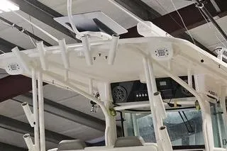 Slide: The Image of 2021 World Cat 325 CC boat interior, featuring spacious deck and seating area. - 16