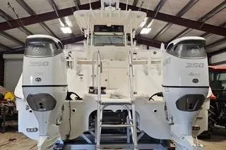 Slide: The Image of 2021 World Cat 325 CC boat with dual 350 engines in a storage facility. - 18