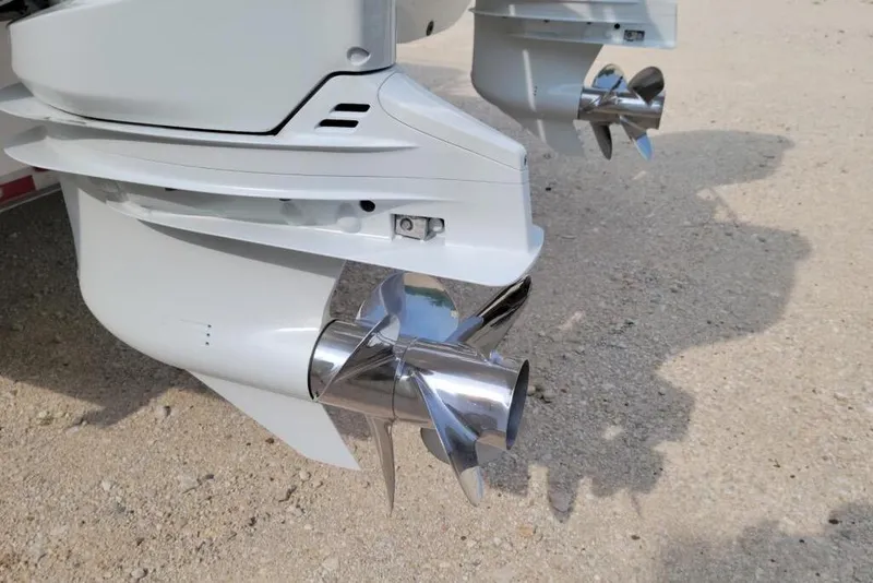 Slide: The Image of 2021 World Cat 325 CC boat with dual Suzuki 350 outboard engines, rear view. - 3