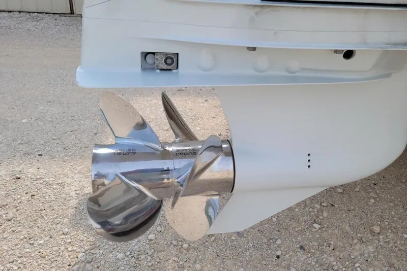 Slide: The Image of 2021 World Cat 325 CC boat on trailer, rear view showing hull and trailer details. - 6