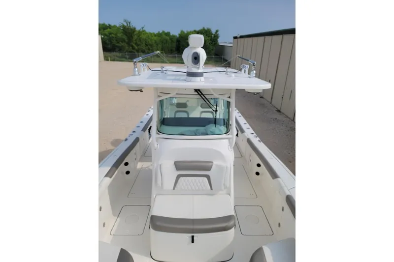 Slide: The Image of Close-up of a 2021 World Cat 325 CC boat propeller on gravel surface. - 7