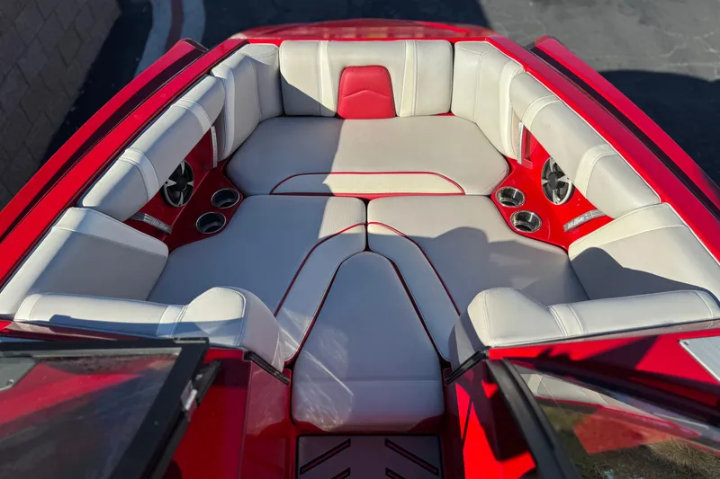 Slide: The Image of 2018 Malibu Wakesetter 21 MLX boat interior with red and white seating. - 14