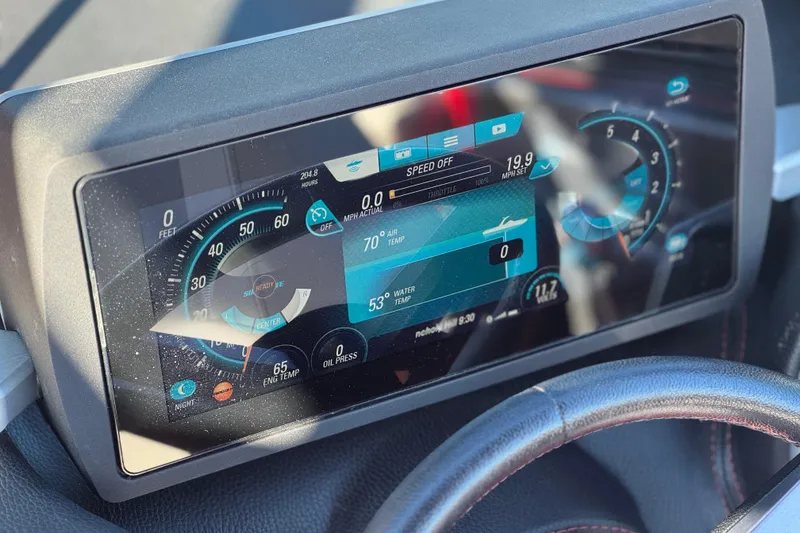 Slide: The Image of Dashboard of a 2018 Malibu Wakesetter 21 MLX boat with digital display. - 30