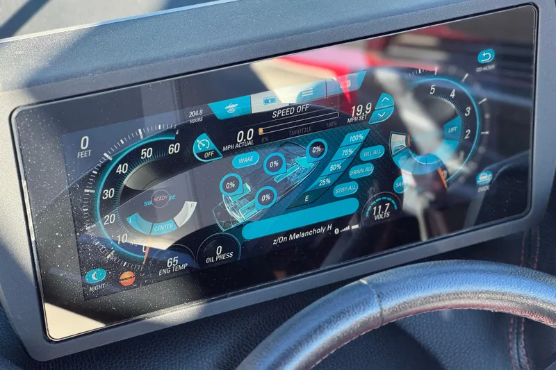 Slide: The Image of Dashboard display of a 2018 Malibu Wakesetter 21 MLX boat, showing speed and engine data. - 31