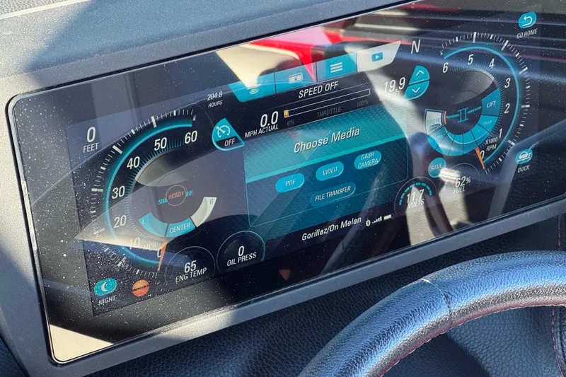 Slide: The Image of Dashboard of 2018 Malibu Wakesetter 21 MLX with digital display and controls. - 33