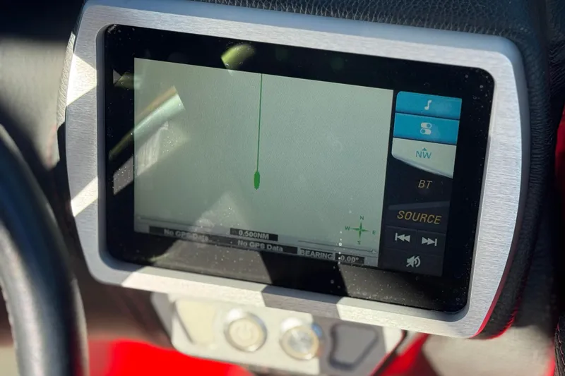 Slide: The Image of 2018 Malibu Wakesetter 21 MLX dashboard display with navigation screen. - 36