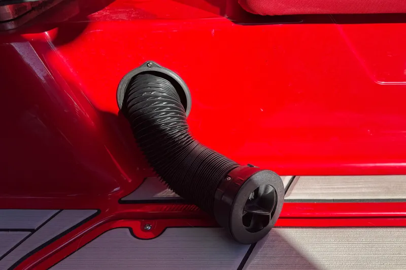 Slide: The Image of 2018 Malibu Wakesetter 21 MLX red exterior with black exhaust vent detail. - 39