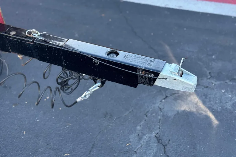 Slide: The Image of Trailer hitch of a 2018 Malibu Wakesetter 21 MLX on asphalt surface. - 41