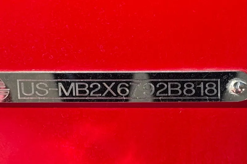 Slide: The Image of VIN plate on 2018 Malibu Wakesetter 21 MLX, red background. - 42