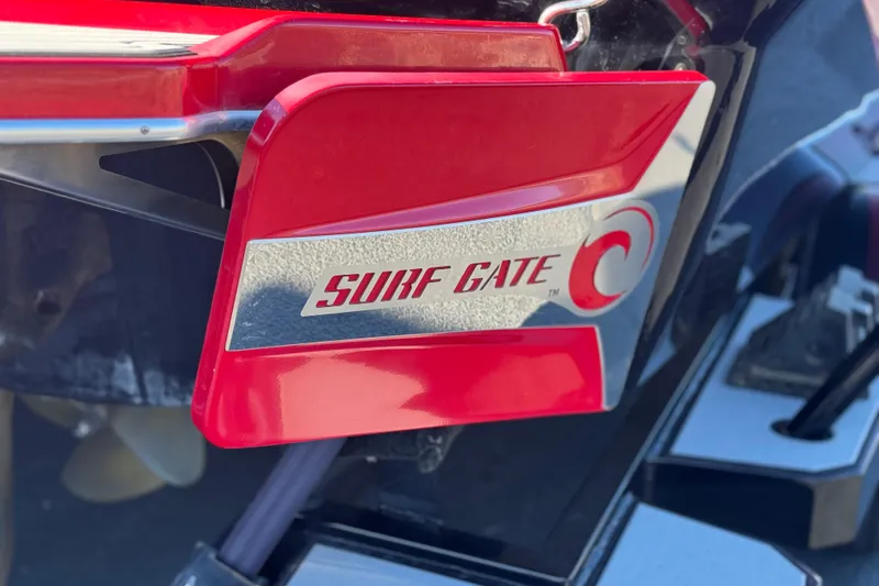 Slide: The Image of 2018 Malibu Wakesetter 21 MLX Surf Gate feature in red and silver. - 7
