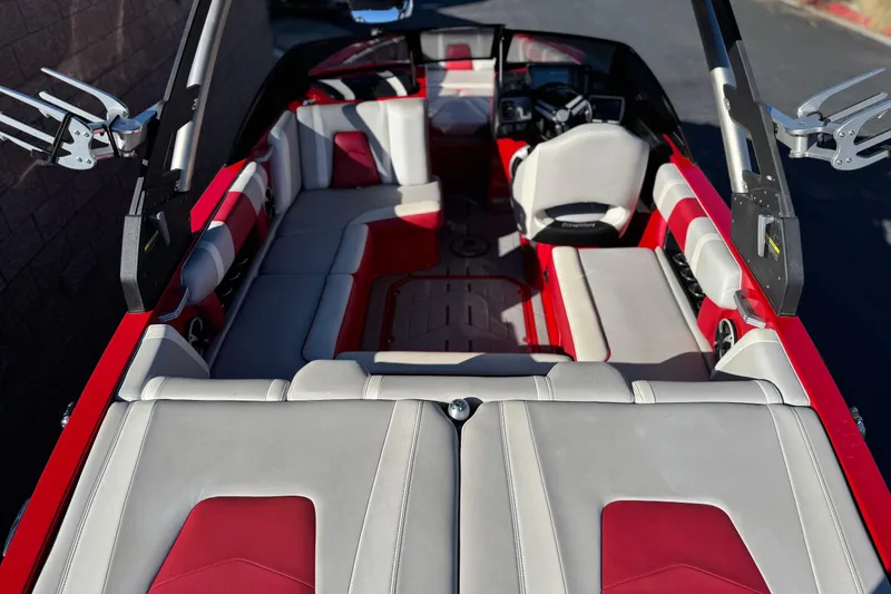 Slide: The Image of 2018 Malibu Wakesetter 21 MLX interior with red and white seating, sleek design. - 9
