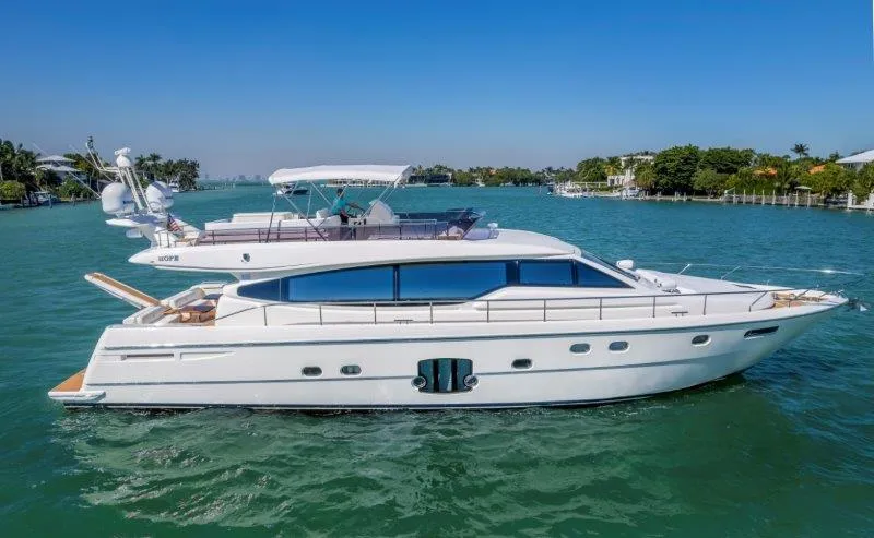 The Image of 2011 Ferretti Yachts 660 cruising on a sunny day in a scenic waterway. - 0